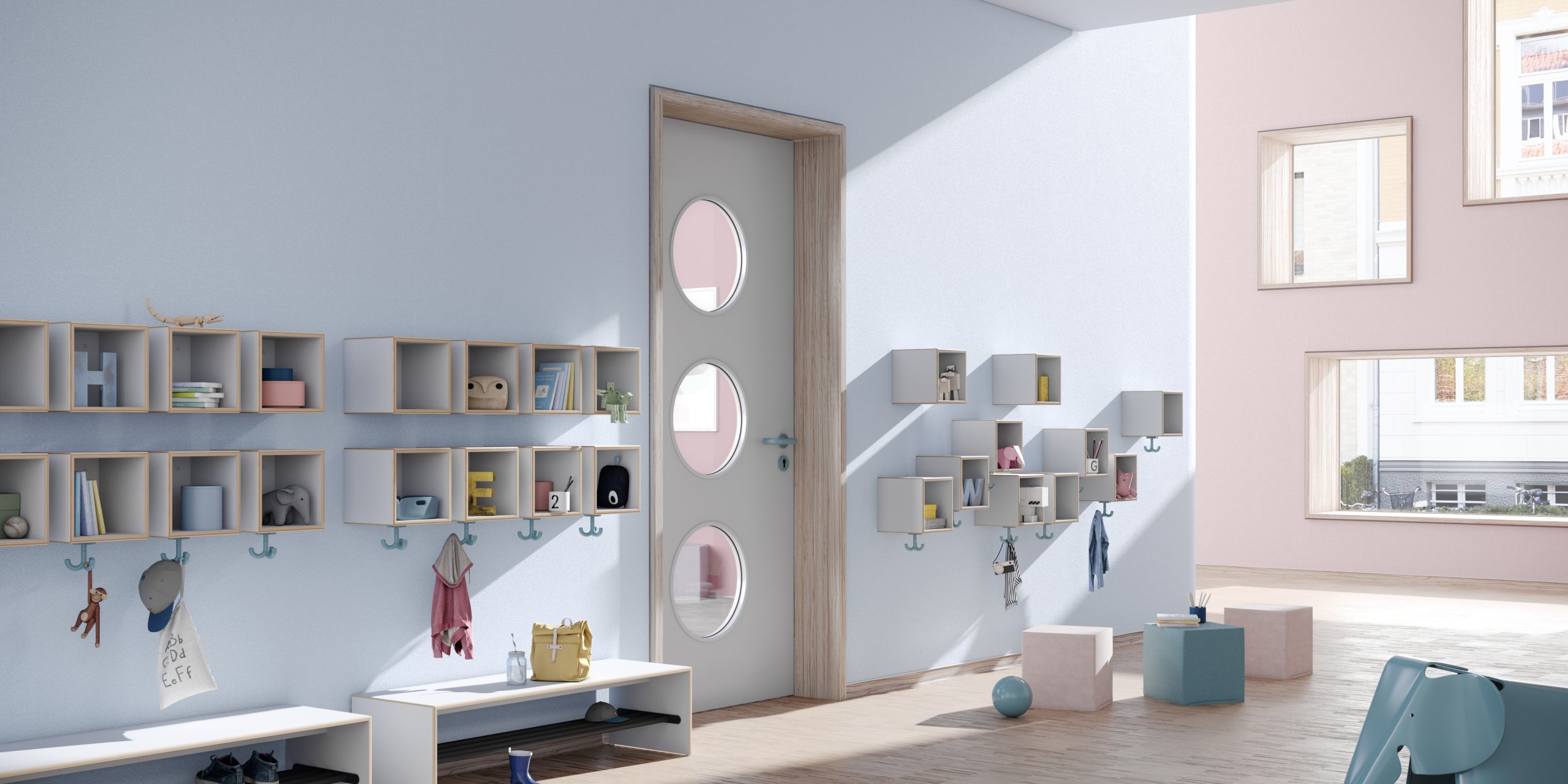 Blue-coloured kindergarten hallway with wall-mounted coat racks, triple hooks and seating